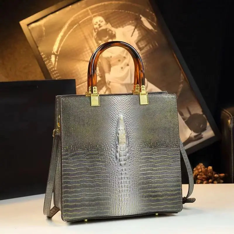 Elevate your everyday elegance with this Genuine Leather Women’s Tote Bag, featuring a luxury crocodile pattern and trend-setting vertical design. Perfect as a fashionable shoulder or messenger bag for stylish women