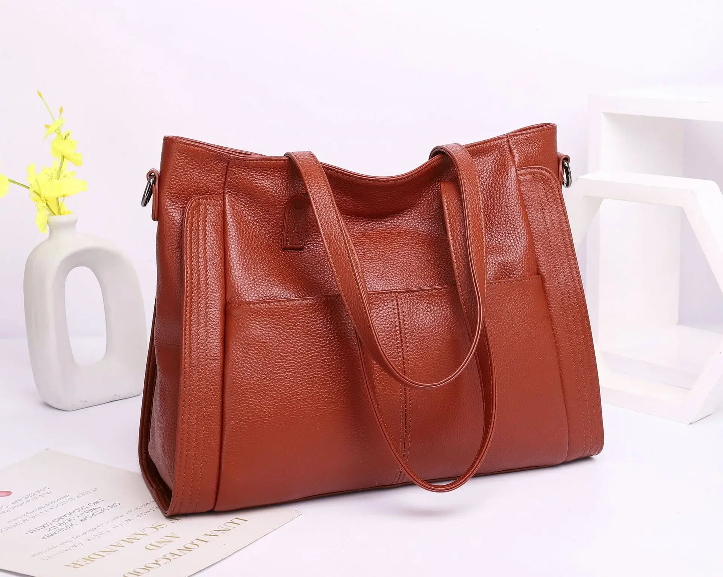 Experience effortless sophistication with this Genuine Leather Cowhide Women’s Tote, a large-capacity luxury designer bag crafted for modern women and mothers. Perfect as a handheld, shoulder, or crossbody bag