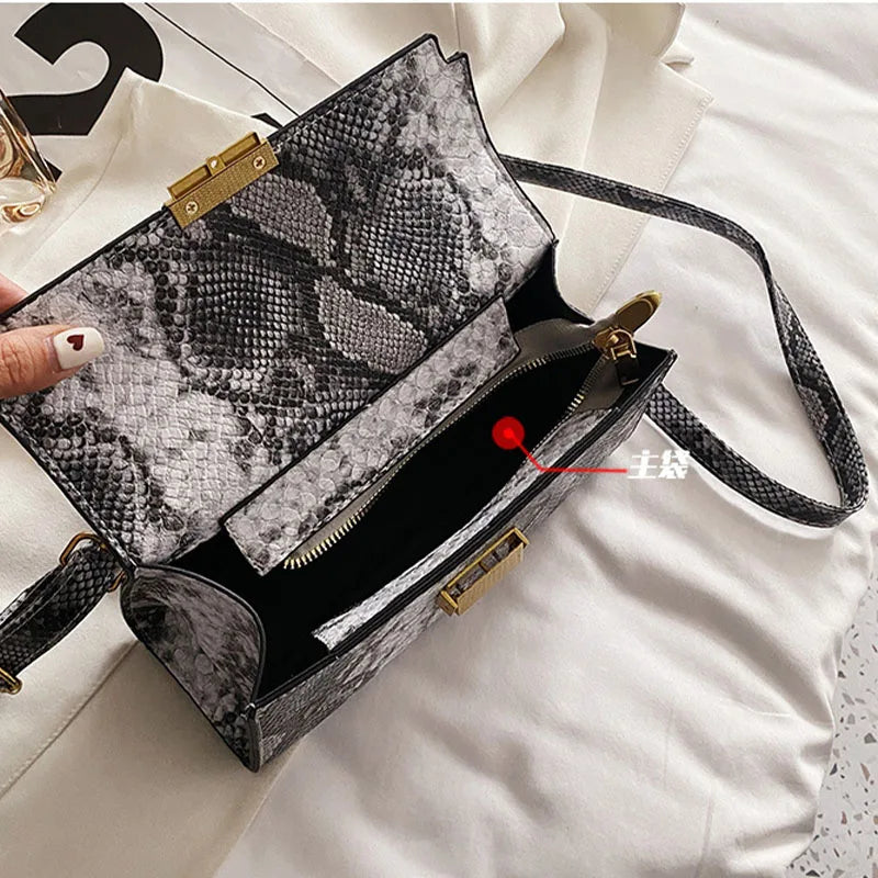 Make a bold statement with this Snakeskin Pattern Luxury Women’s Bag 2023, crafted from premium PU leather with a modern square silhouette. A chic designer tote and crossbody — perfect for confident, fashionable women.

h