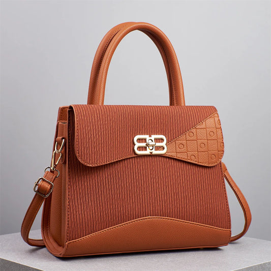 Step into elegance with the Étoile Embossed Tote, a distinguished piece from the Holland Luxe Global Collectors’ Series. Designed with a spacious interior and refined embossed texture, this versatile handbag blends sophist