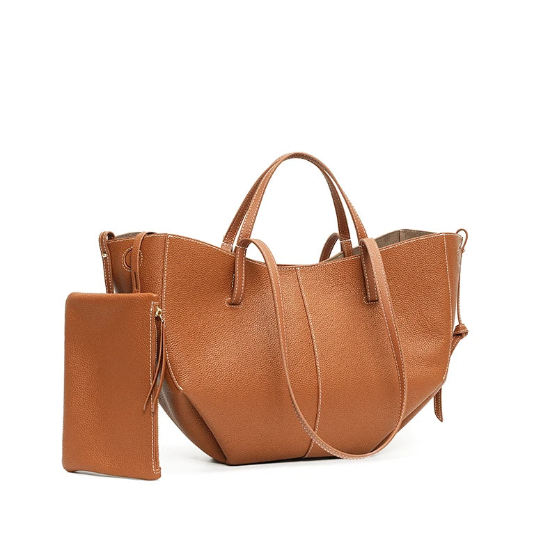 Indulge in timeless elegance with this Luxury Cow Leather Tote Bag, a spacious designer handbag crafted for the modern woman. Stylish and versatile — perfect as a shoulder, hobo, or shopper bag for everyday sophistication.