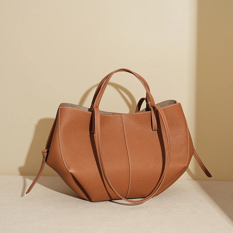 Indulge in timeless elegance with this Luxury Cow Leather Tote Bag, a spacious designer handbag crafted for the modern woman. Stylish and versatile — perfect as a shoulder, hobo, or shopper bag for everyday sophistication.