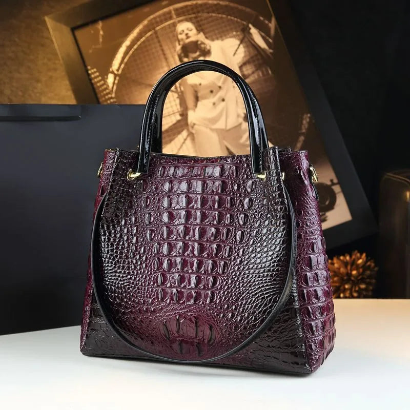 Introducing the Valeria Croco Bucket Tote, a statement piece from the Holland Luxe Global Collectors’ Collection. Designed with a crocodile-embossed finish and a retro-inspired silhouette