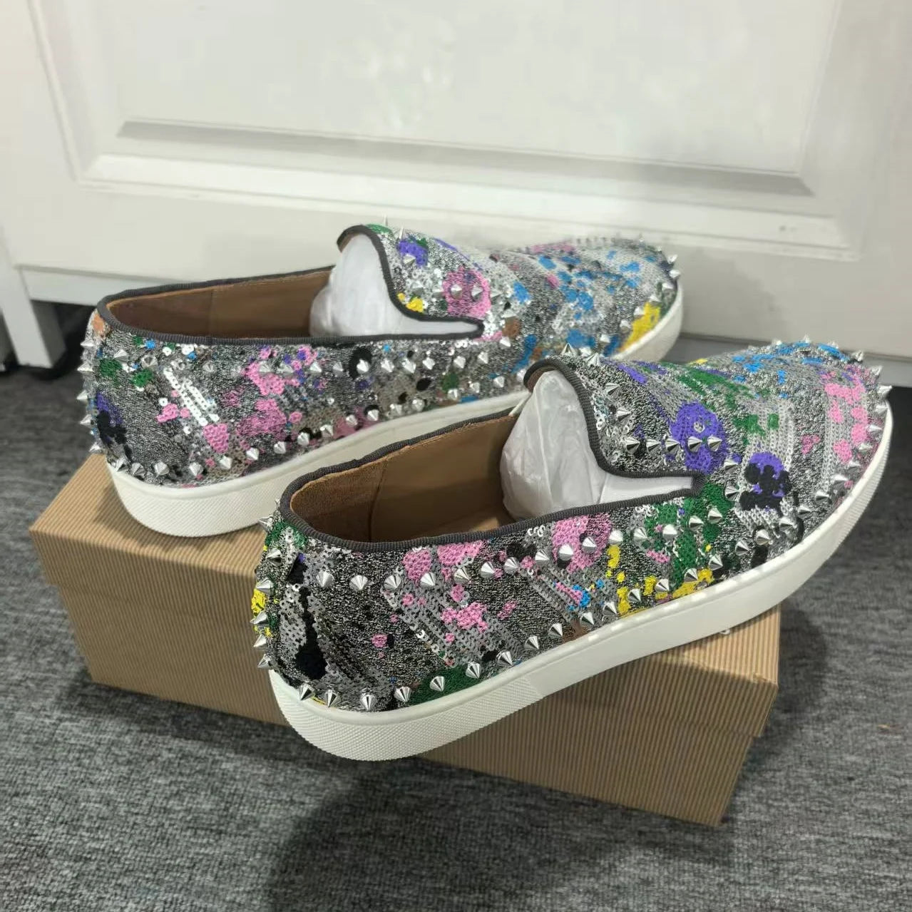 Exclusive to hollandluxeglobal.com, these Men’s Sparkly Sequined Slip-On Sneakers are a true Premium Collector’s Item. Featuring a glittering sequined upper, rivet-studded details, and a comfortable slip-on fit