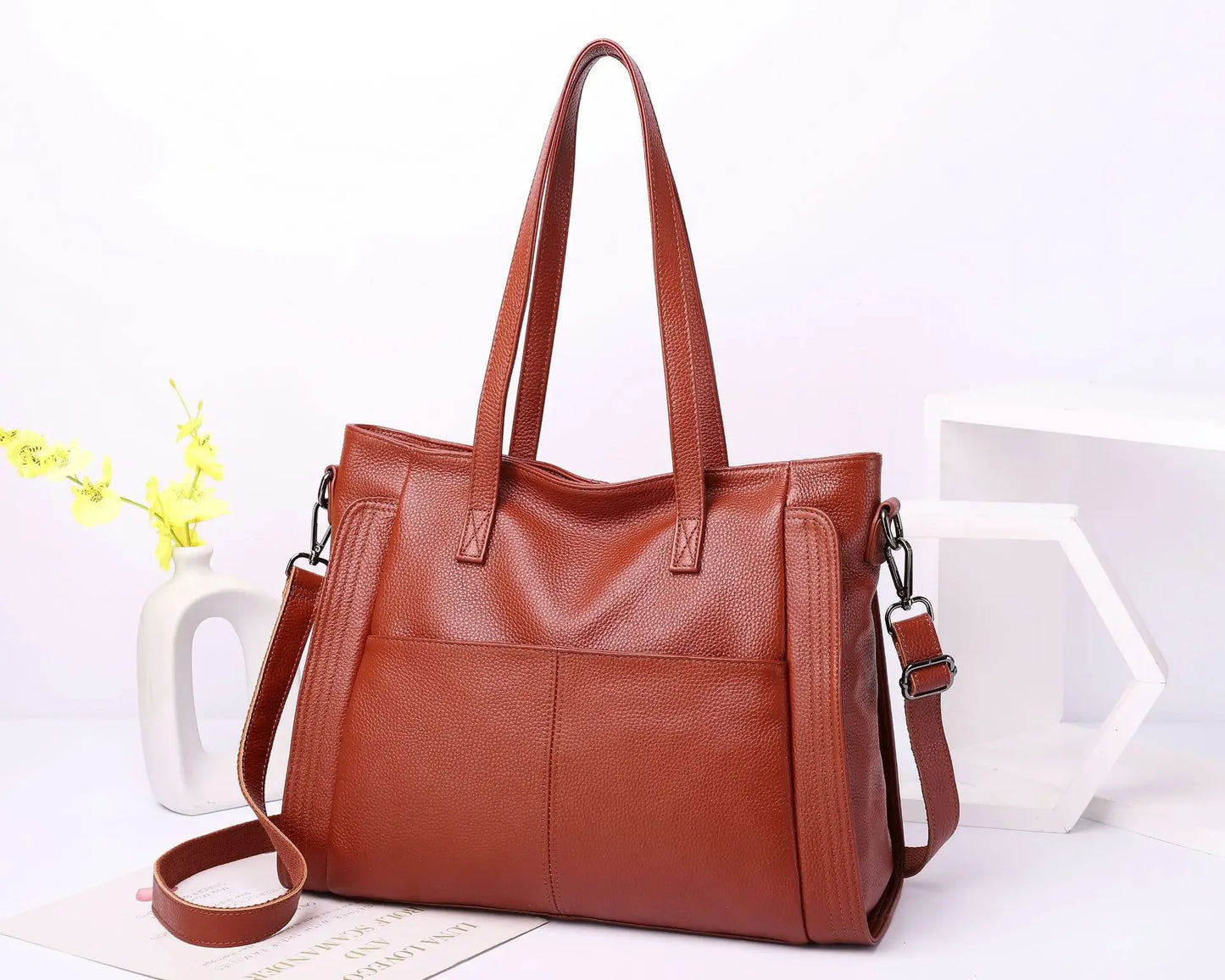 Experience effortless sophistication with this Genuine Leather Cowhide Women’s Tote, a large-capacity luxury designer bag crafted for modern women and mothers. Perfect as a handheld, shoulder, or crossbody bag