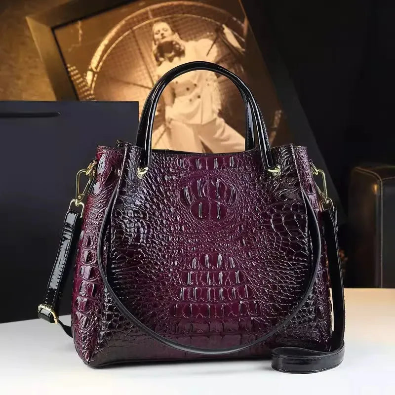 Introducing the Valeria Croco Bucket Tote, a statement piece from the Holland Luxe Global Collectors’ Collection. Designed with a crocodile-embossed finish and a retro-inspired silhouette