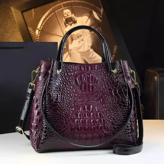 Introducing the Valeria Croco Bucket Tote, a statement piece from the Holland Luxe Global Collectors’ Collection. Designed with a crocodile-embossed finish and a retro-inspired silhouette