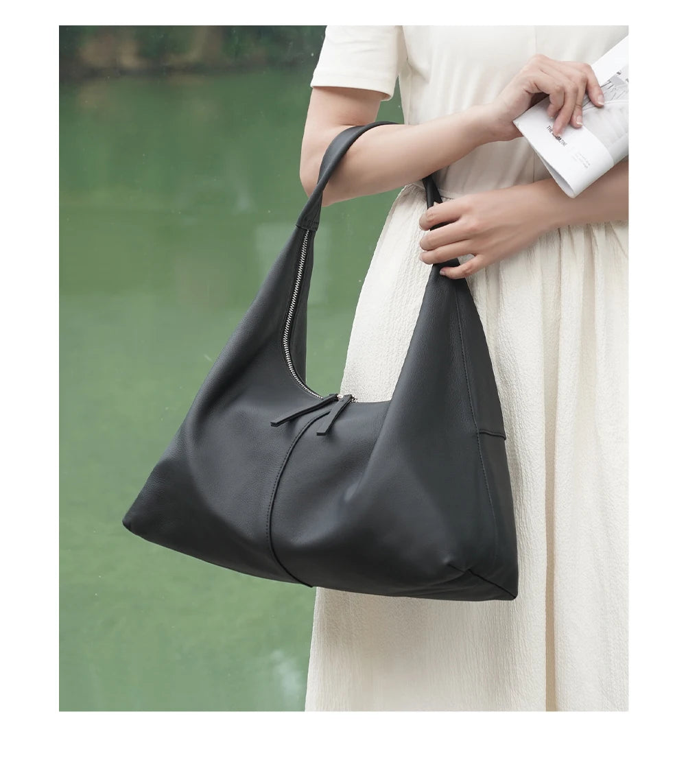 Stay stylish and organized with the Zency Large-Capacity Tote Bag, crafted from 100% genuine leather. A soft and elegant hobo-style handbag perfect for work, shopping, or winter outings — ideal for modern women
