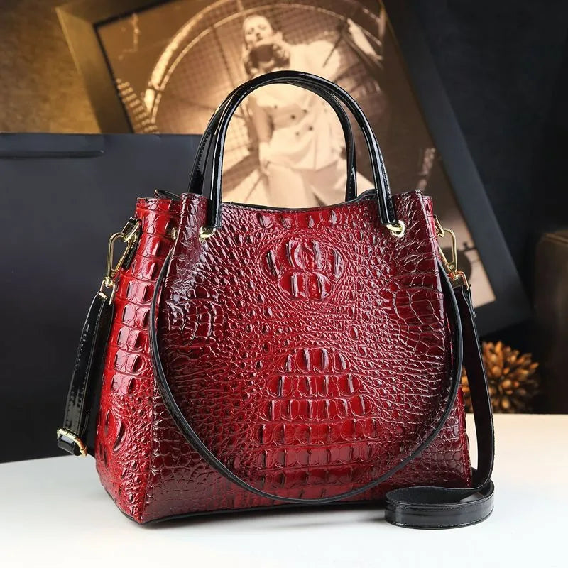 Introducing the Valeria Croco Bucket Tote, a statement piece from the Holland Luxe Global Collectors’ Collection. Designed with a crocodile-embossed finish and a retro-inspired silhouette
