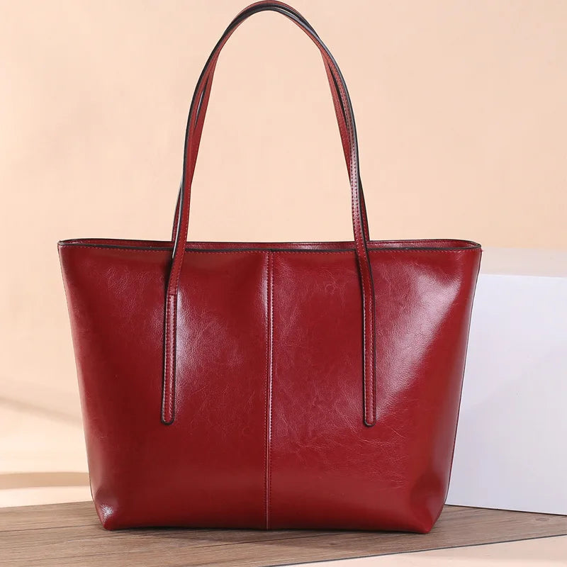 Refined and versatile, this Large-Capacity Cowhide Tote Bag combines high-quality craftsmanship with timeless fashion. Designed for modern women — perfect as a handheld, shoulder, or commuter shopping bag for everyday use
