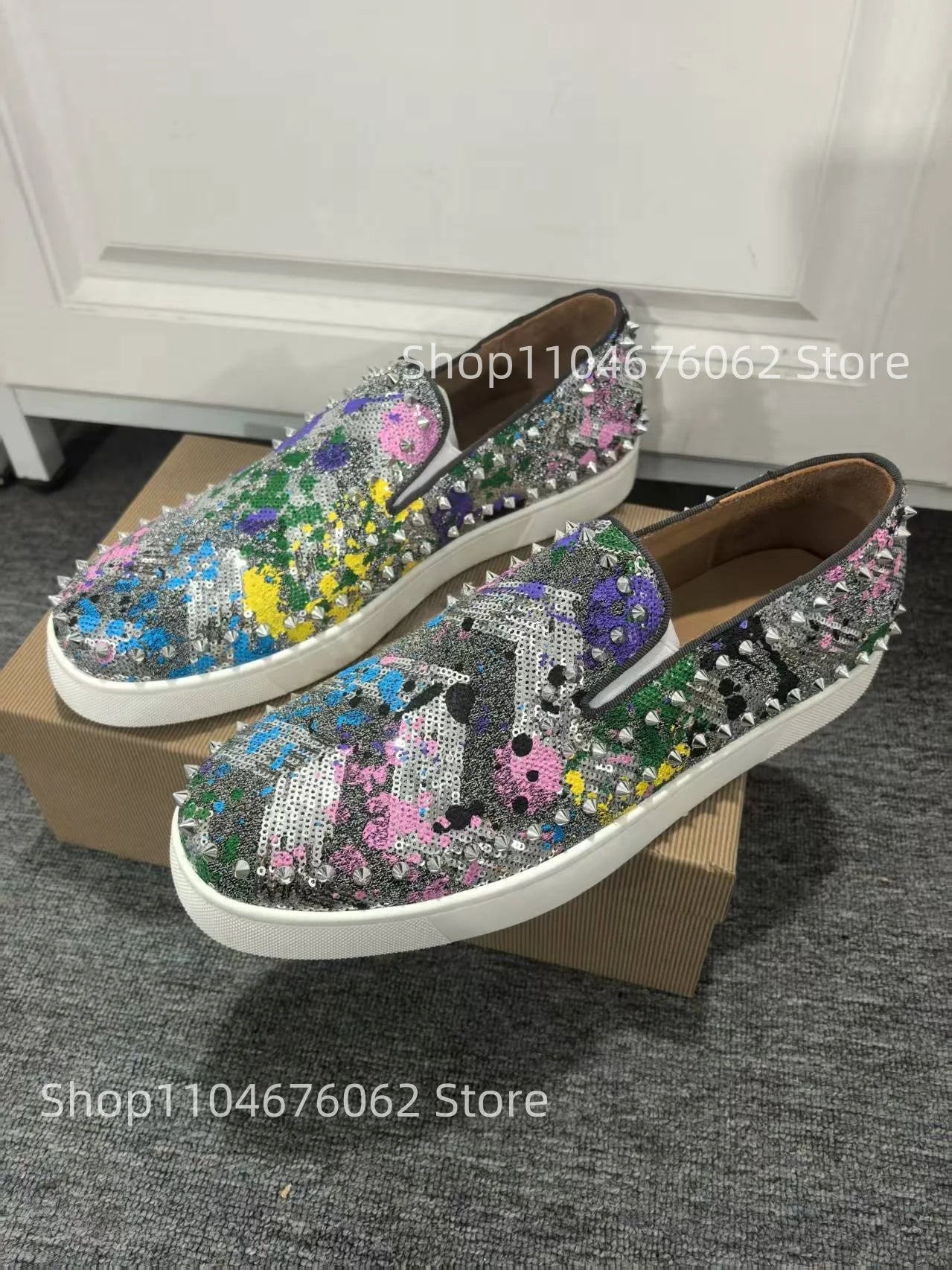 Exclusive to hollandluxeglobal.com, these Men’s Sparkly Sequined Slip-On Sneakers are a true Premium Collector’s Item. Featuring a glittering sequined upper, rivet-studded details, and a comfortable slip-on fit
