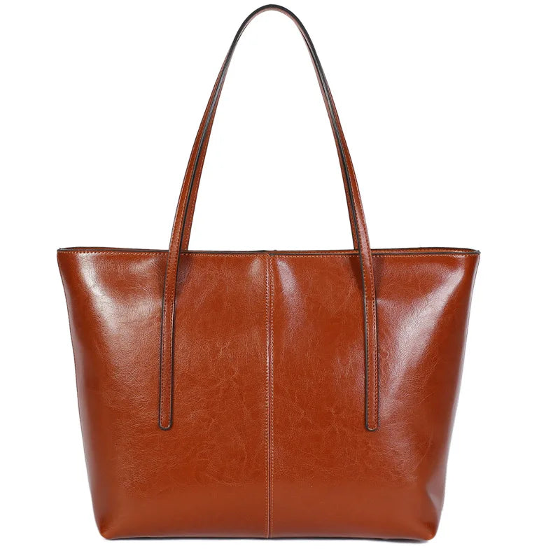 Refined and versatile, this Large-Capacity Cowhide Tote Bag combines high-quality craftsmanship with timeless fashion. Designed for modern women — perfect as a handheld, shoulder, or commuter shopping bag for everyday use